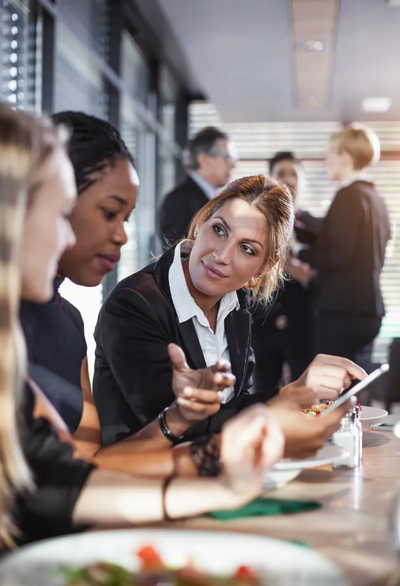 Business People Having a Meal at a Cafe Restaurant